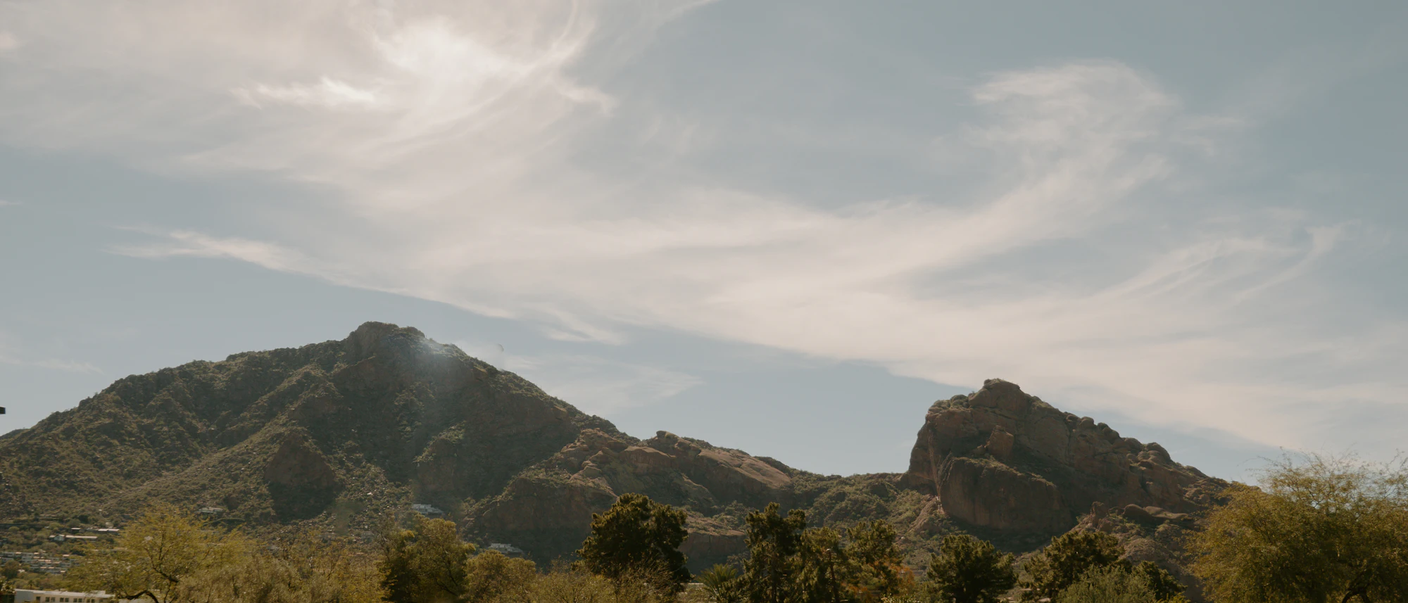 Desert mountains under soft cloud
